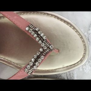 Pink vinyl and diamond rhinestone flip flops